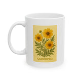 White mug with coreopsis flower design and 'Coreopsis' text on a white background