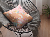 Decorative pillow with floral pattern orange and pink