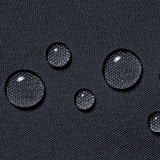 Water droplets on a black textured surface
