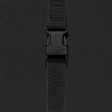 Close-up of a black strap with a buckle on a dark background