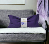 Ultimate Hot & Cold Herbal Neck Pillows - Natural Pain Relief with a label on a gray couch