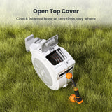 Retractable Garden Hose Reel-1/2 in-65ftwith open top cover on grass, showing an orange and black water gun.