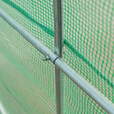 Close-up of a green safety net with metal poles