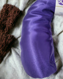Ultimate Hot & Cold Herbal Neck Pillows - Natural Pain Relief on a textured surface with a brown lace item and white fabric.