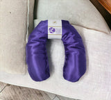 Ultimate Hot & Cold Herbal Neck Pillows - Natural Pain Relief with a label on a white surface