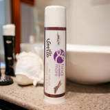 Vanilla Lavender lip balm on a bathroom counter with blurred background