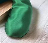 Ultimate Hot & Cold Herbal Neck Pillows - Natural Pain Relief on a wooden surface