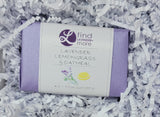 Bar of soap with 'find lavender more' branding on a bed of white paper shreds