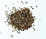 Pile of dried seeds on a white background