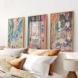 Henri Matisse Abstract Painting Wall Art Prints on a wall above a sofa with pillows.