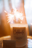 Candle labeled 'Celebrate' with a sparkler in the background