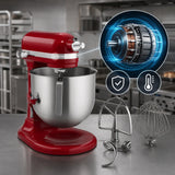 A red stand mixer with a stainless steel bowl sits on a countertop in a commercial kitchen setting. An inset graphic shows the motor internals, and additional attachments are placed beside the mixer.
