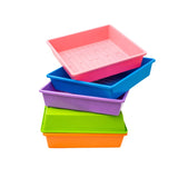 Stack of colorful plastic trays in pink, blue, purple, green, and orange on a white background. 1010 Trays 2.5" Deep - Extra Strength