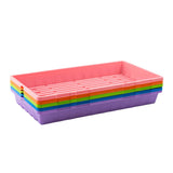 Stack of colorful plastic trays on a white background