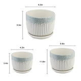 Set of three ceramic planters with measurements on a white background