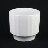 White Stoneware Planter with Fluted Designon a black background