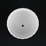 White Stoneware Planter with Fluted Design on a black background