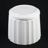 White ceramic container with ribbed texture on a black background 3-Piece White Ceramic Planter Pot Set with Fluted Design & Saucers