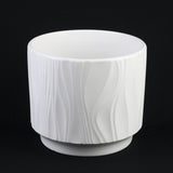 White Stoneware Planter Pot with Embossed Texture on a black background