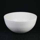 White ceramic bowl on a black background