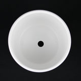 3-Piece White Stoneware Planter Pot Set with Vertical Line Texture on a black background