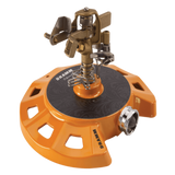 Orange and brown sprinkler head with 'Drumm' branding on a white background
