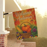 Decorative flag with 'Welcome Autumn' text and autumn-themed design hanging on a porch.