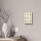 Decorative wall art with plant illustrations on a neutral wall above a desk.