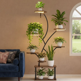Decorative indoor plant stand with multiple shelves holding potted plants in a living room setting.