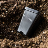 Metallic device with a logo embedded in the ground