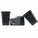 Three black plastic components on a white background