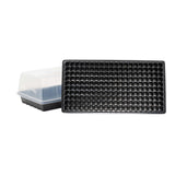 Black seedling tray with small holes on a white background