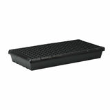Black plastic seed tray with small holes on a white background