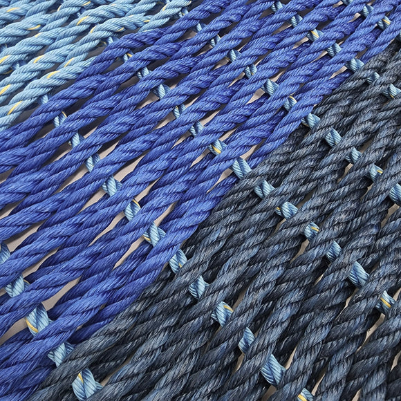 Close-up of blue and gray woven fabric with a gradient effect.