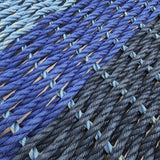 Close-up of blue and gray woven fabric with a gradient effect.