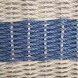 Close-up of woven pattern with blue and gray ropes