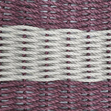 Close-up of woven pattern with alternating pink and white ropes.