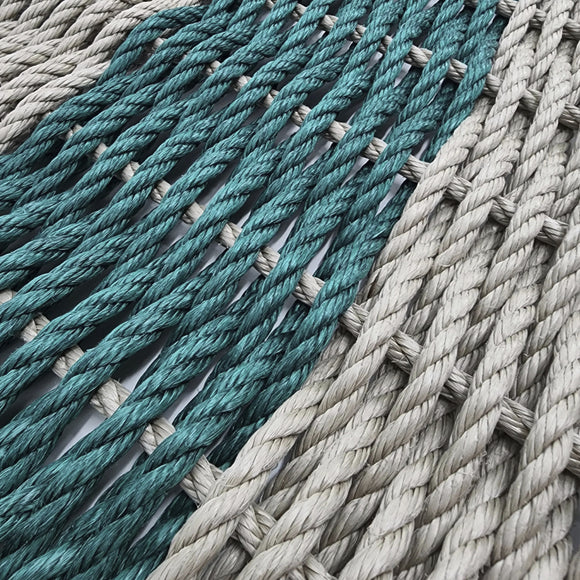 Close-up of teal and gray woven rope mat