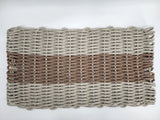 Woven mat with striped pattern on a white background