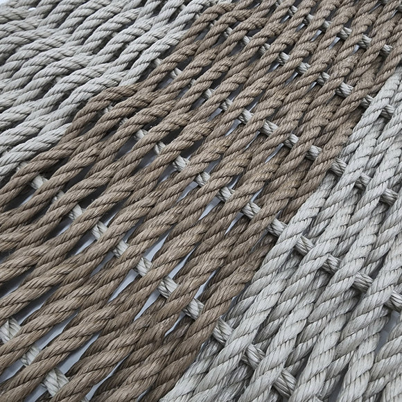Close-up of braided rope in beige and brown tones.
