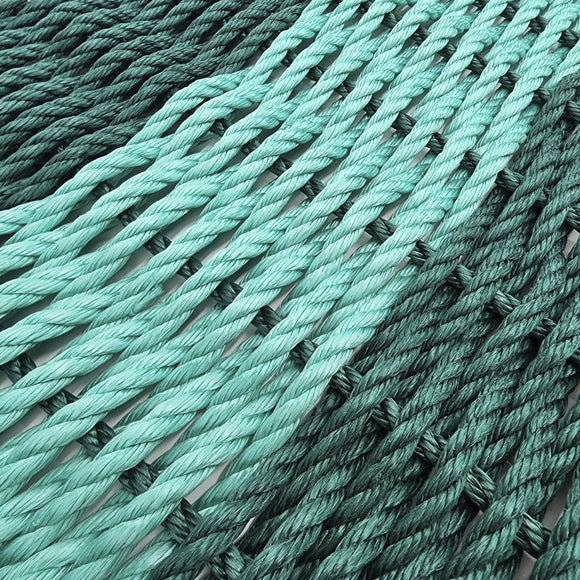 Close-up of green rope with a white background