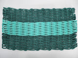 Two woven baskets, one green and one blue, on a white background