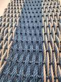 Close-up of woven pattern with blue and beige ropes