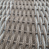 Close-up of braided rope with a patterned texture.