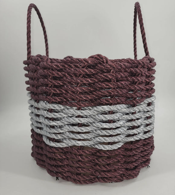 Rope basket with two-tone design on a white background