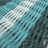 Close-up of teal and green ropes with a gradient effect.