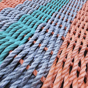 Close-up of multicolored ropes arranged in a pattern
