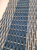 Close-up of woven fabric with blue and beige threads
