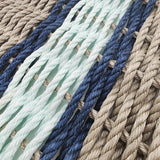 Close-up of braided ropes in various colors including blue, green, and beige.