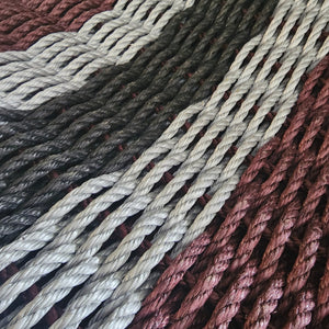 Close-up of braided ropes in various colors.